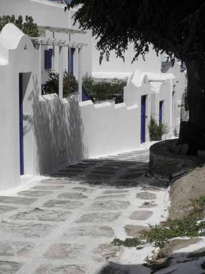 "Walking winding paths toward center of Mykonos"
