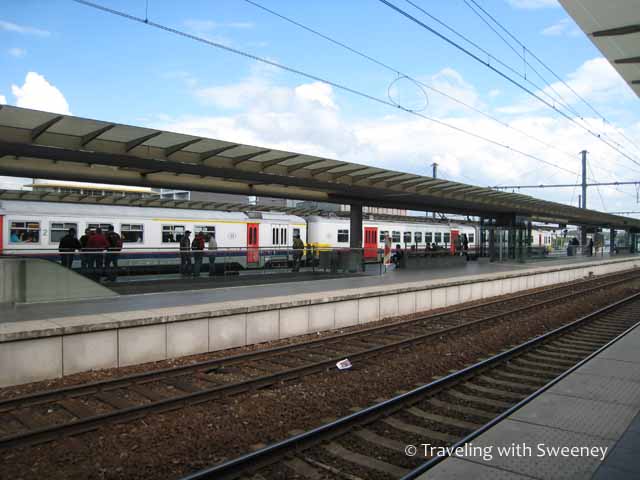"Waiting on the platform at Bruges Central Station"